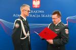 Dyrektor wręcza akt powołania swojemu zastępcy nadinsp. Maciejowi Filłończukowi
